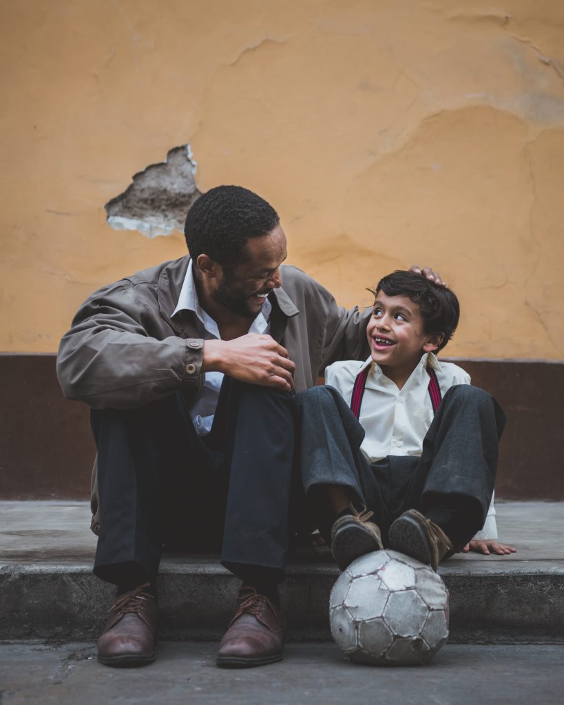 A man and his son enjoying time together. To form better connections with your family, find a counselor near Glen Cove, NY.