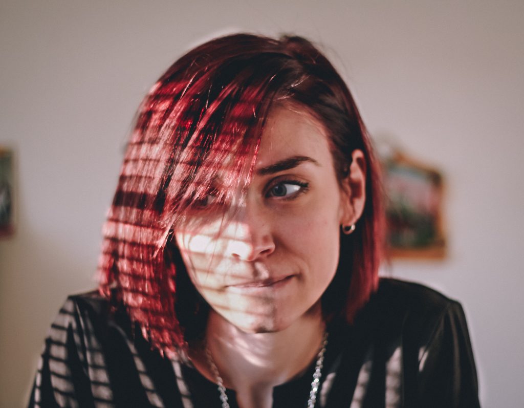 Woman with red hair unsure of herself. Looking for CBT and EMDR therapy near Ronkonkoma, NY.