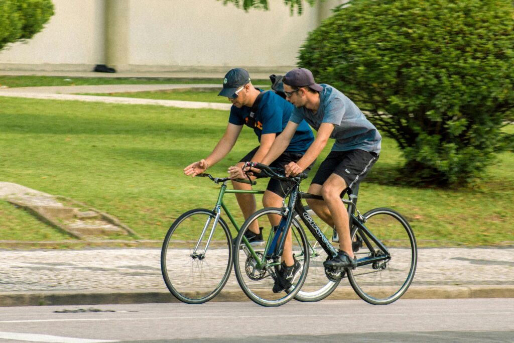 Two men biking.