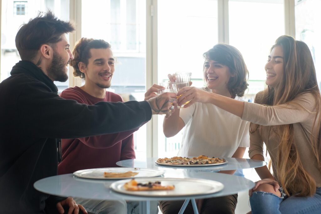 Friends toasting after they managed to overcome social challenges.