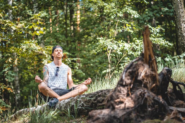 A man meditating in the nature